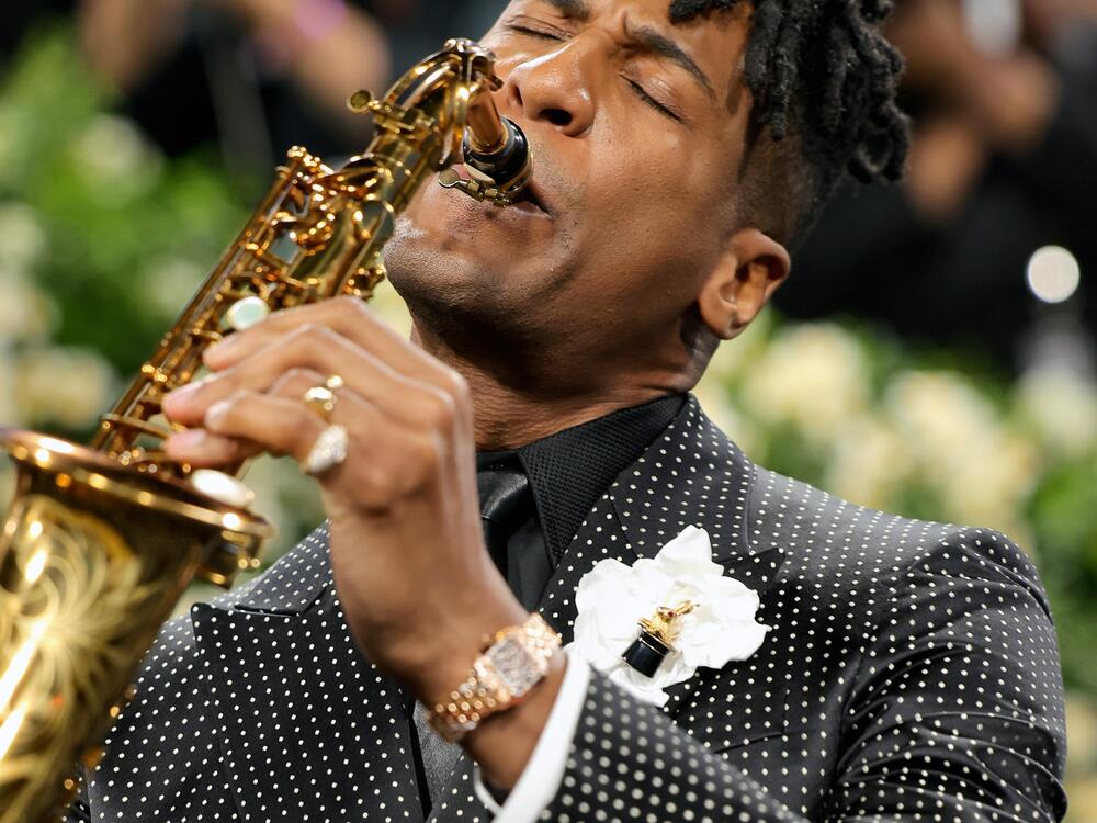 Jon Batiste performs while attending the 2025 Met Gala.