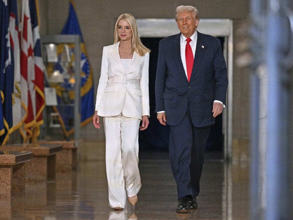President Trump arrives with Attorney General Pam Bondi to speak at the Justice Department on March 14.