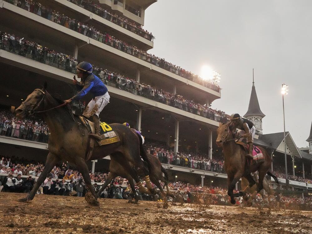 Sovereignty, ridden by Junior Alvarado, left, crosses the finish line to win the 151st running of the Kentucky Derby horse race followed by Journalism, ridden by Umberto Rispoli, at Churchill Downs on Saturday, May 3, 2025, in Louisville, Ky.