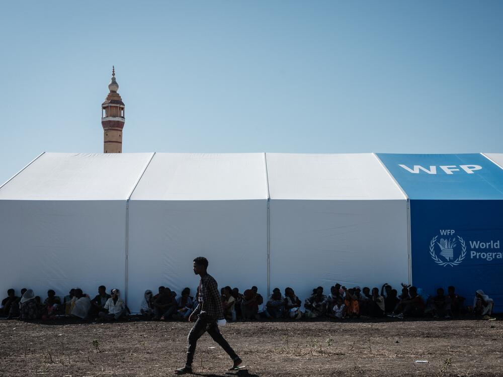 Ethiopian refugees rest in the shadow of a warehouse erected by the World Food Programme near the Ethiopian border in Gedaref, eastern Sudan.