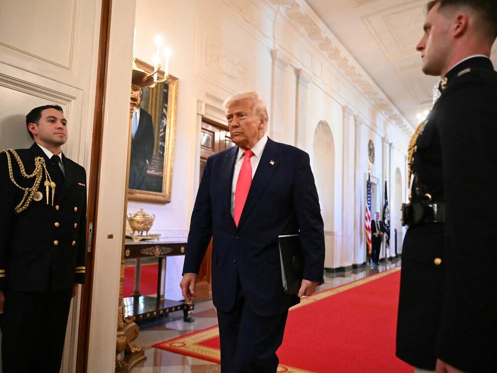President Trump heads to the East Room of the White House to sign an executive order.