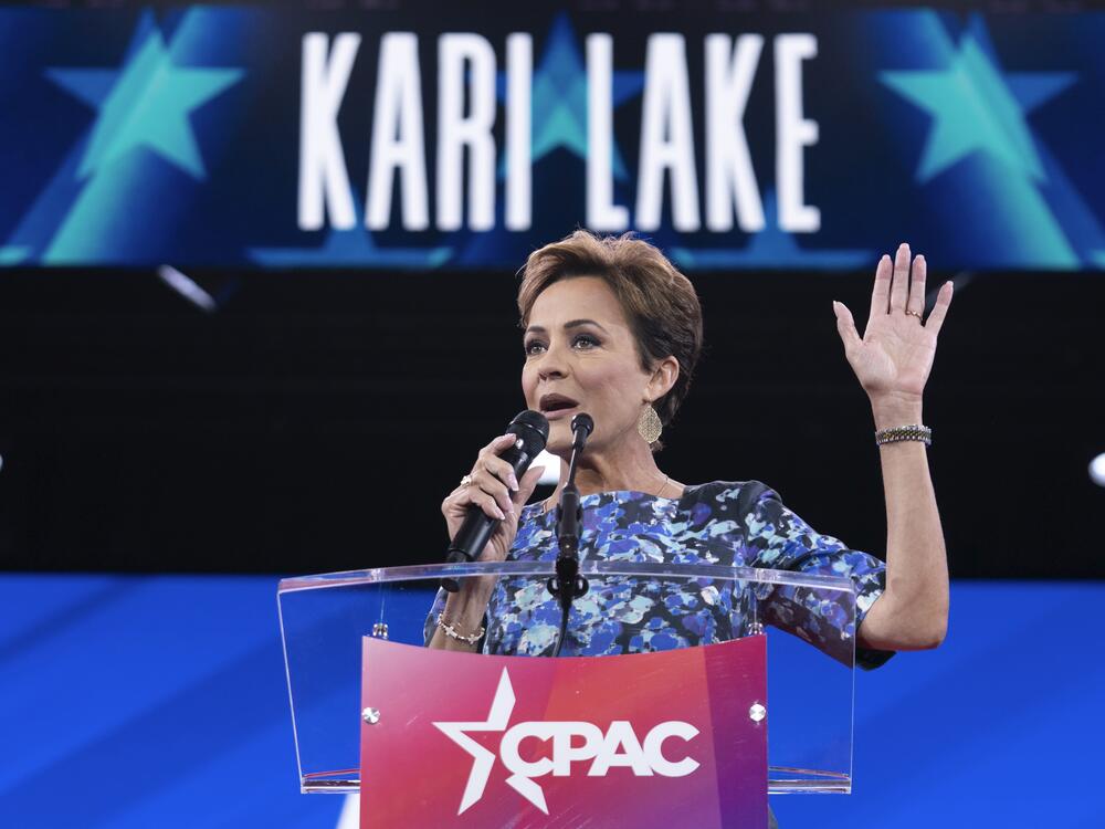 Senior Trump adviser Kari Lake, shown above at a conservative conference earlier this year, announced Tuesday night that Voice of America would rely on coverage from the far-right television network OAN. Voice of America employees that Lake put on indefinite leave are suing to be restored to their jobs.