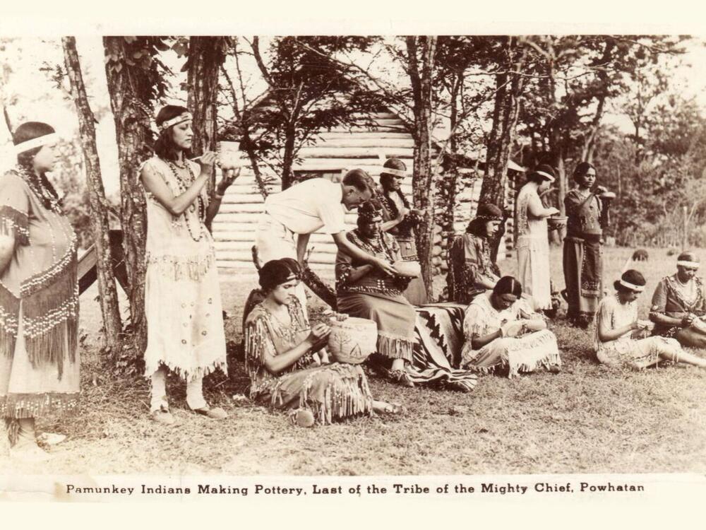 Pamunkey women making pottery at the Pottery School on the reservation in the early 20th century.