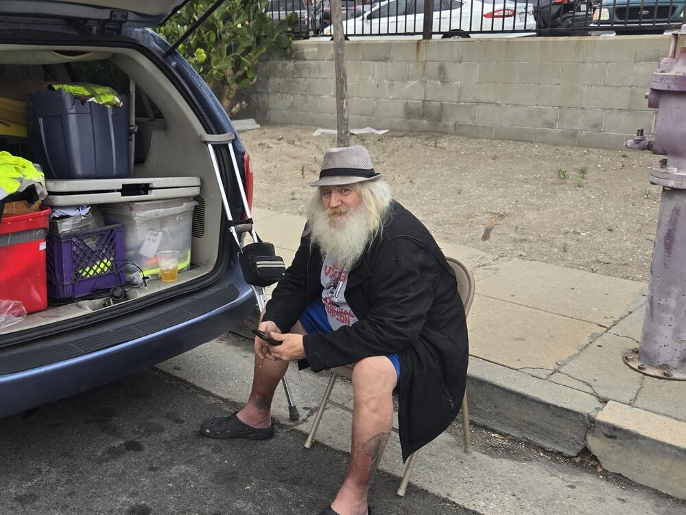 Frank Groves waits outside the ILWU Local 13 dispatch office for workers to purchase gloves and safety gear. He's one of many whose incomes have been impacted by the drop in cargo. <br>