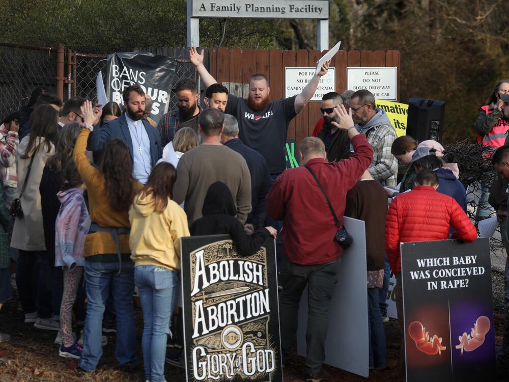 Anti-abortion activists pray and protest in front of the Greenville Women's Clinic in Greenville, S.C., in March.