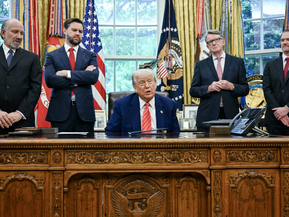 President Trump announces a trade agreement with the United Kingdom on May 8, 2025 as Commerce Secretary Howard Lutnick, Vice President Vance, British Ambassador Peter Mandelson and U.S. Trade Representative Jamieson Greer look on.