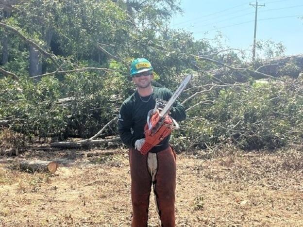 AmeriCorps team leader Theo Faucher in Florida, where his group cleared debris from Hurricane Debby. He said the agency is 