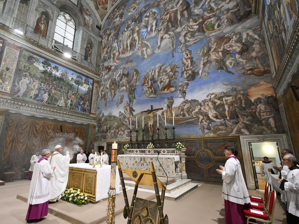 Newly elected Pope Leo XIV, second from left, concelebrates Mass with the College of Cardinals inside the Sistine Chapel at the Vatican the day after his election as 267th pontiff of the Roman Catholic Church, Friday, May 9, 2025.