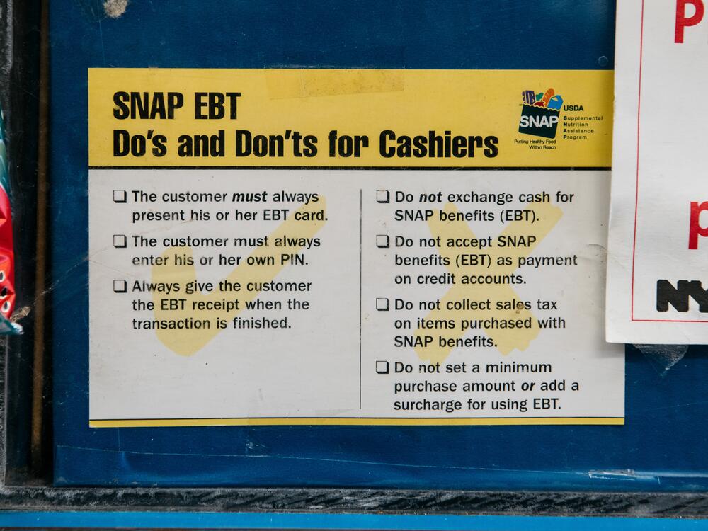 A sign alerting customers about SNAP food stamps benefits is displayed in a Brooklyn grocery store on Dec. 5, 2019 in New York City.