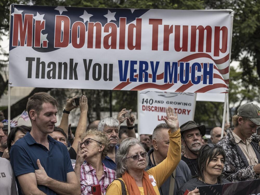 Afrikaan South Africans supporting US President Donald Trump and South African and US tech billionaire Elon Musk gather in front of the US Embassy in Pretoria, on February 15, 2025 for a demonstration.