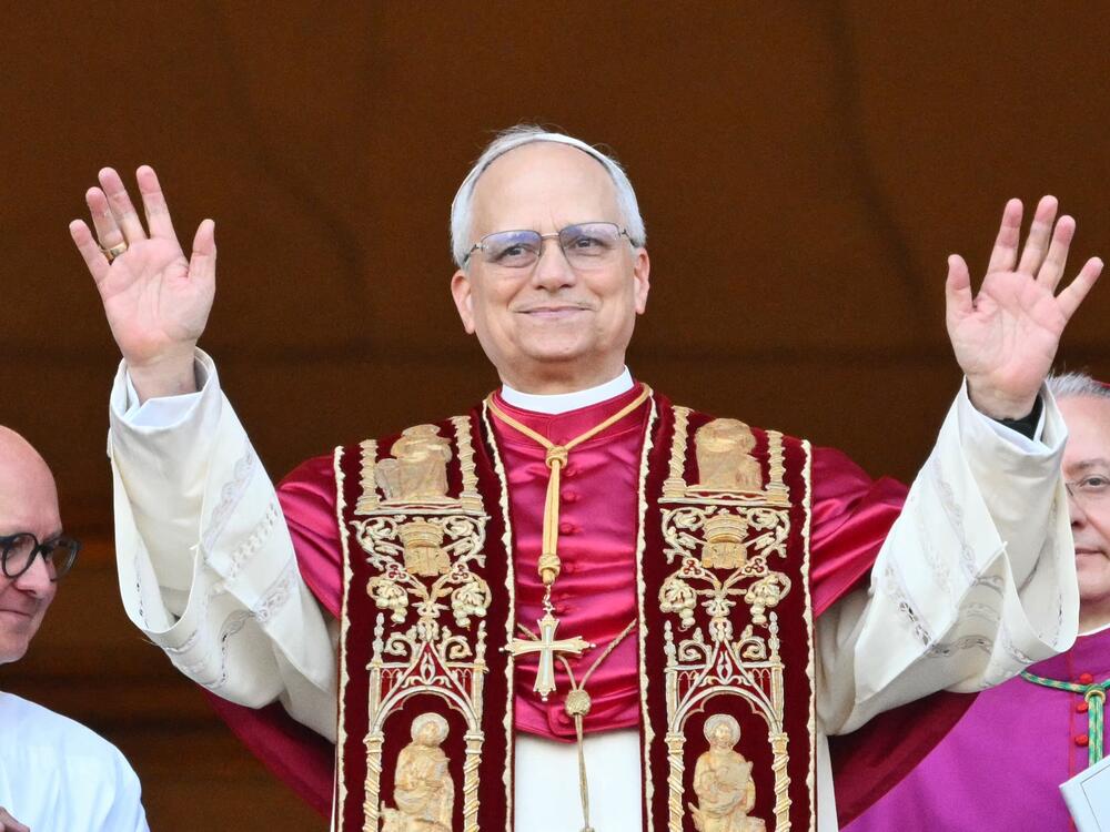 Pope Leo XIV greets the public for the first time from the main balcony of St. Peter's Basilica.