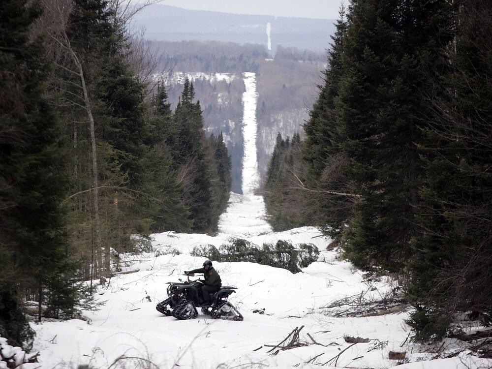 A U.S. border patrol agent rides an ATV along 