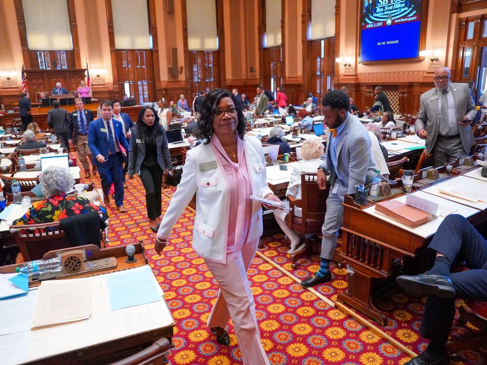 Democratic lawmakers, led by Minority Leader Carolyn Hugley, walk out of the Georgia House of Representatives last month, skipping a vote on a bill to ban gender-affirming care for inmates in state prisons.
