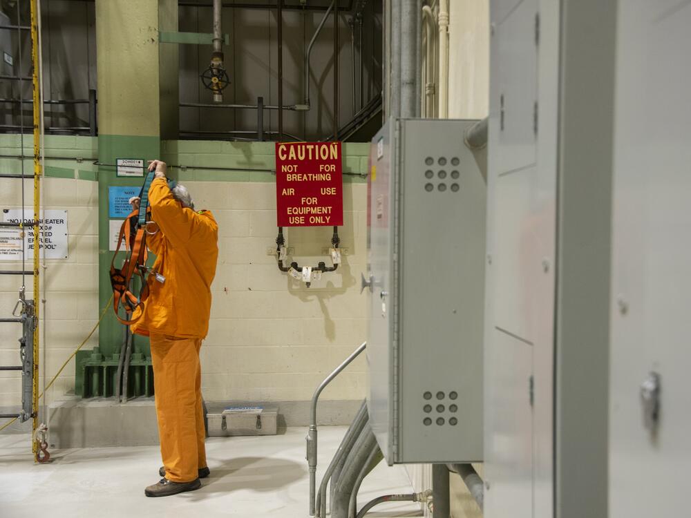 A worker dons safety equipment at the Peach Bottom nuclear plant in Delta, Pennsylvania, U.S., on Tuesday, Feb. 19, 2019. The NRC sets radiation safety standards for nuclear workers and the public.