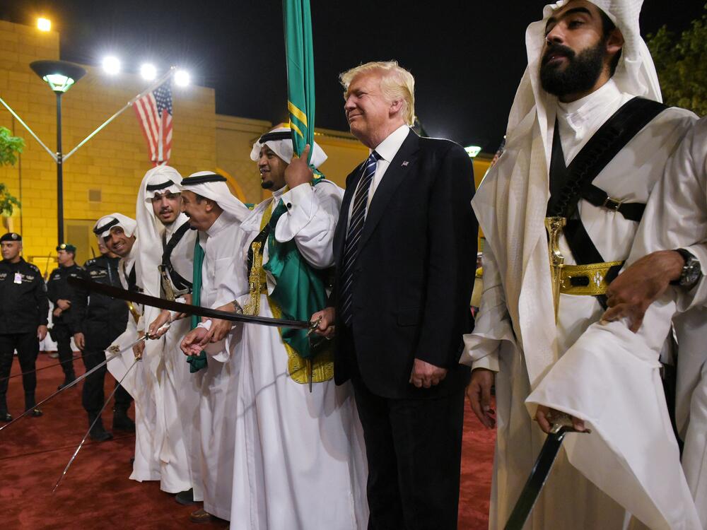 President Trump joins dancers with swords at a welcome ceremony in Riyadh, Saudi Arabia, on May 20, 2017.