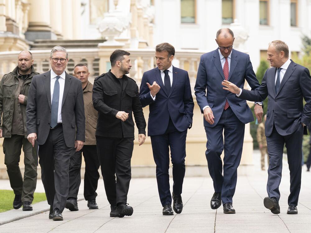 From second left, British Prime Minister Keir Starmer, Ukrainian President Volodymyr Zelenskyy, French President Emmanuel Macron, German Chancellor Friedrich Merz and Poland's Prime Minister Donald Tusk walk at the Presidential Palace in Kyiv, Ukraine, Saturday May 10, 2025.