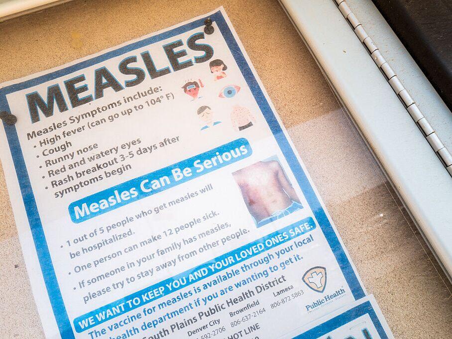 A measles advisory is shown tacked to a bulletin board outside Gaines County Courthouse on April 09, 2025 in Seminole, Texas.