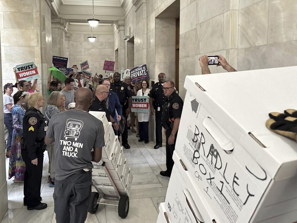 Boxes containing signatures supporting a proposed ballot measure to scale back Arkansas' abortion ban are delivered to the state Capitol in Little Rock, Ark., on July 5, 2024. Arkansas lawmakers this year passed new restrictions on citizen-led ballot measures.