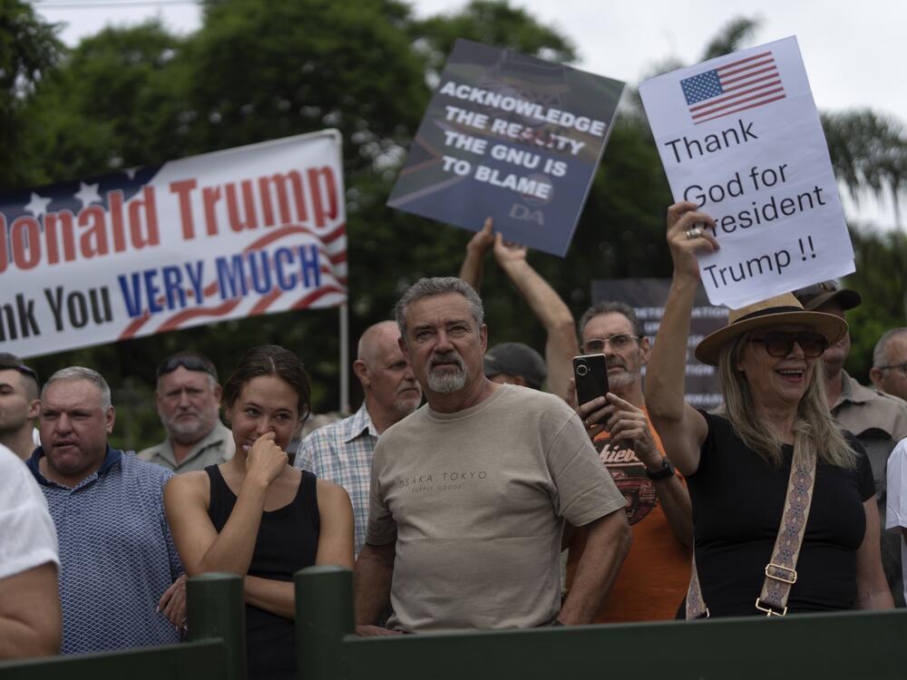 White South Africans demonstrate in support of President Trump in front of the U.S. Embassy in Pretoria, South Africa, on Feb. 15.