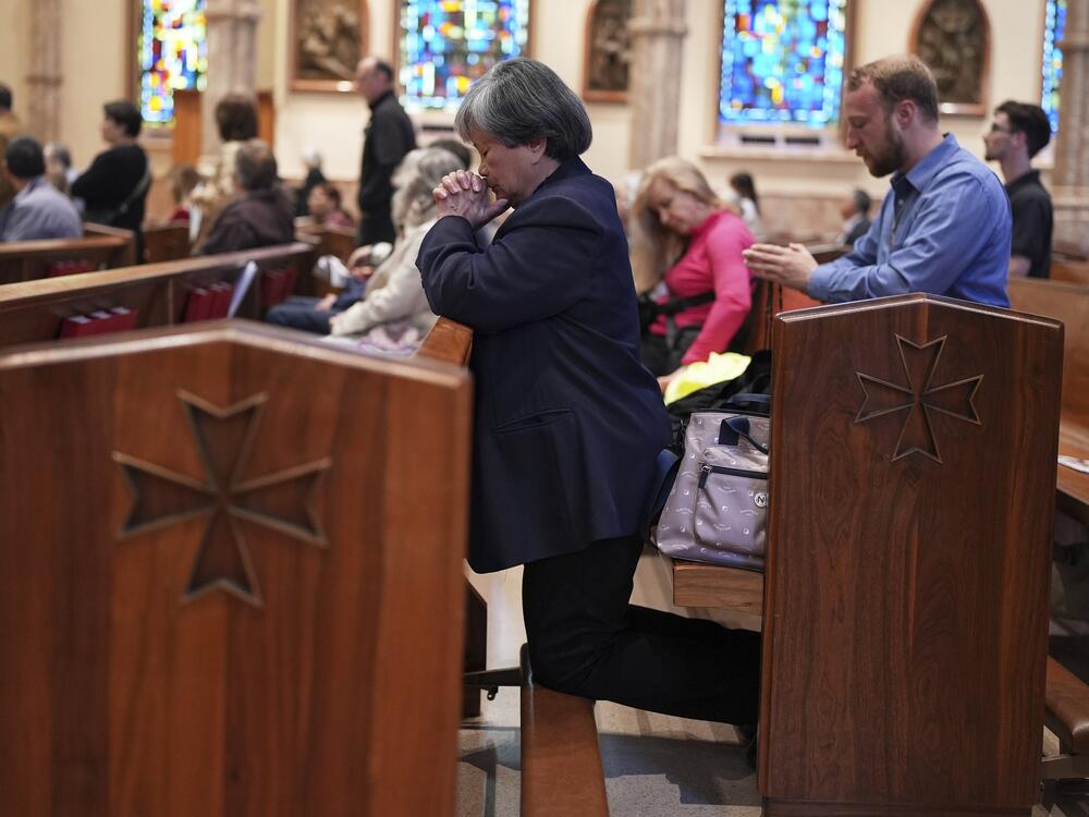 Parishioners pray during a mass at Holy Name Cathedral in Chicago on Sunday.