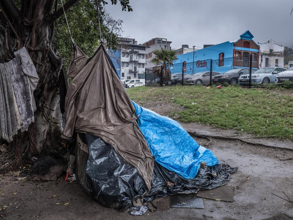 Makeshift tents occupied by homeless people are seen in front of the atFrits Dog Hotel and Daycare, a luxury pet accommodation, in Cape Town, South Africa.