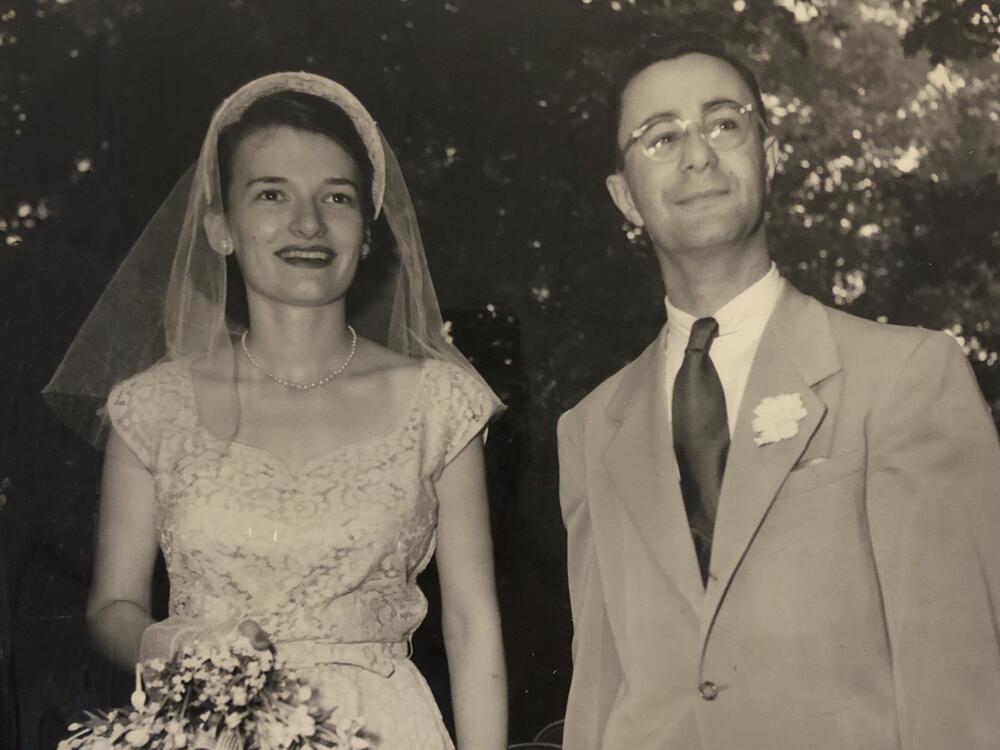 Elisabeth Simons stands with her husband, Harold Simons, at their wedding.