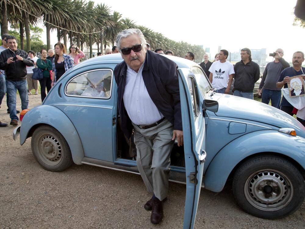 José Mujica, Uruguay's president at the time, arrives in his 1987 Volkswagen Beetle to cast his vote in Montevideo in October 2014.