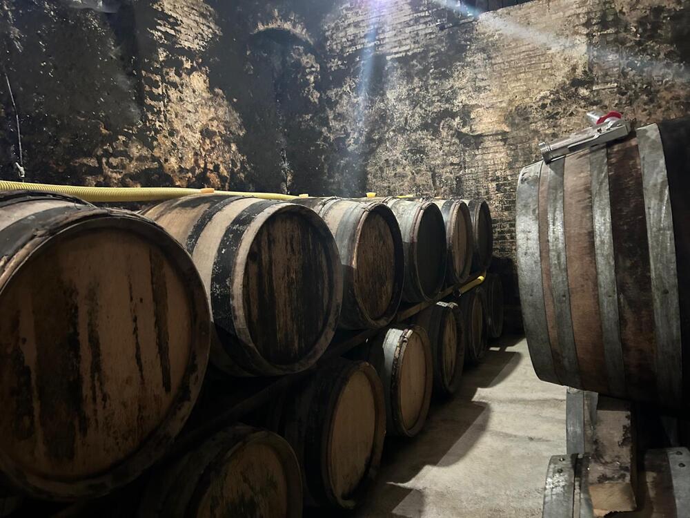 Champagne barrels line the deep, cool cellars of Charles Fourny's estate in Vertus, France. Fourny says President Trump's impending tariffs has taken away his trust in the U.S. market.