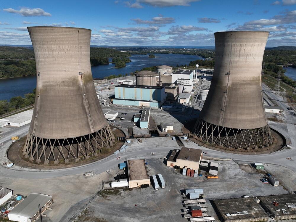 The shuttered Three Mile Island nuclear power plant stands in the middle of the Susquehanna River on October 10, 2024. One of the plant's two reactors partly melted down in 1979, but the second one operated for decades before it was closed. It is now set to be restarted as early as 2028, pending approval by the Nuclear Regulatory Commission.