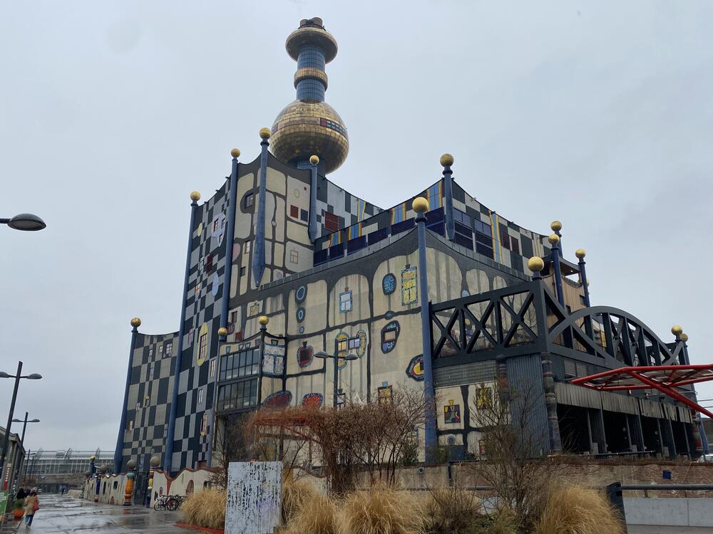 Vienna's trash incinerator, Spitellau, is covered with art. To get off planet-heating natural gas, Vienna is heating buildings using heat pumps, capturing gases from waste, burning waste, and geothermal wells.