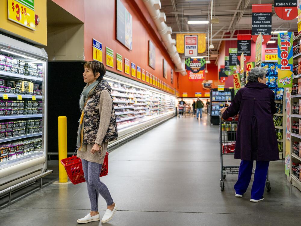 Customers shop for produce at a grocery store on Feb. 12, 2025 in Austin, Texas.