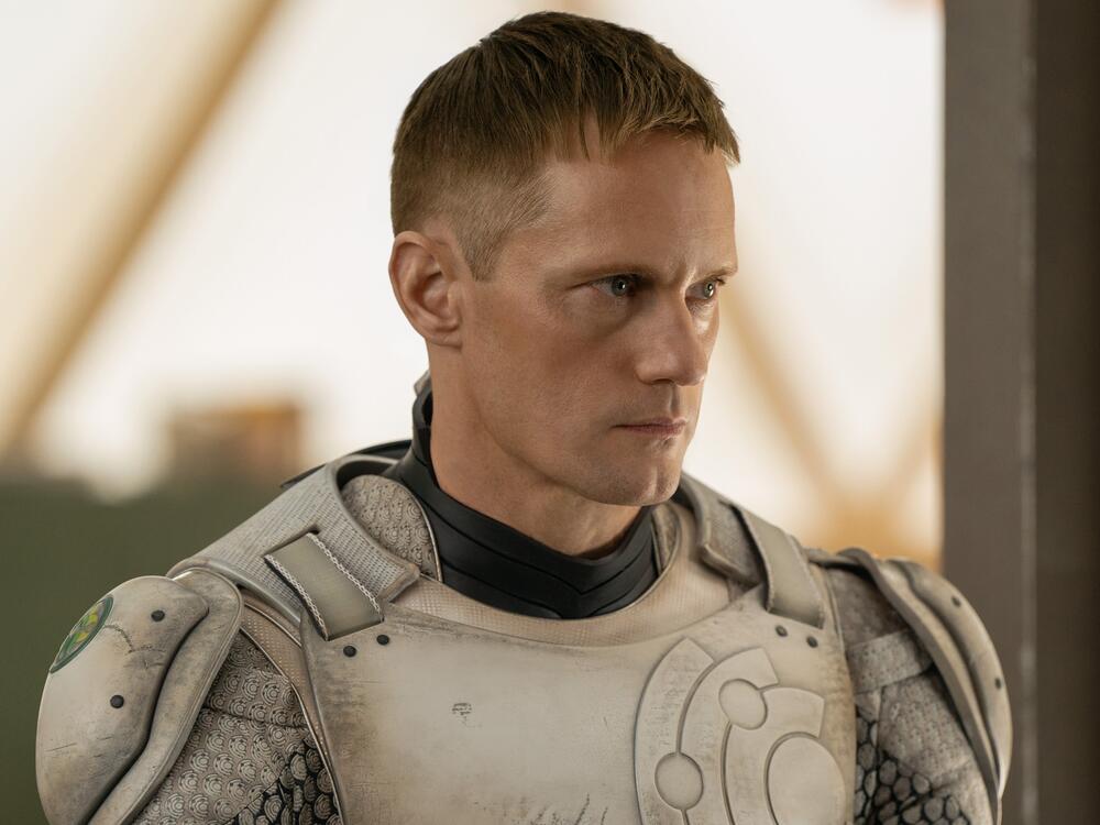 Alexander Skarsgård in <em>Murderbot</em>, which starts Friday on Apple TV+.