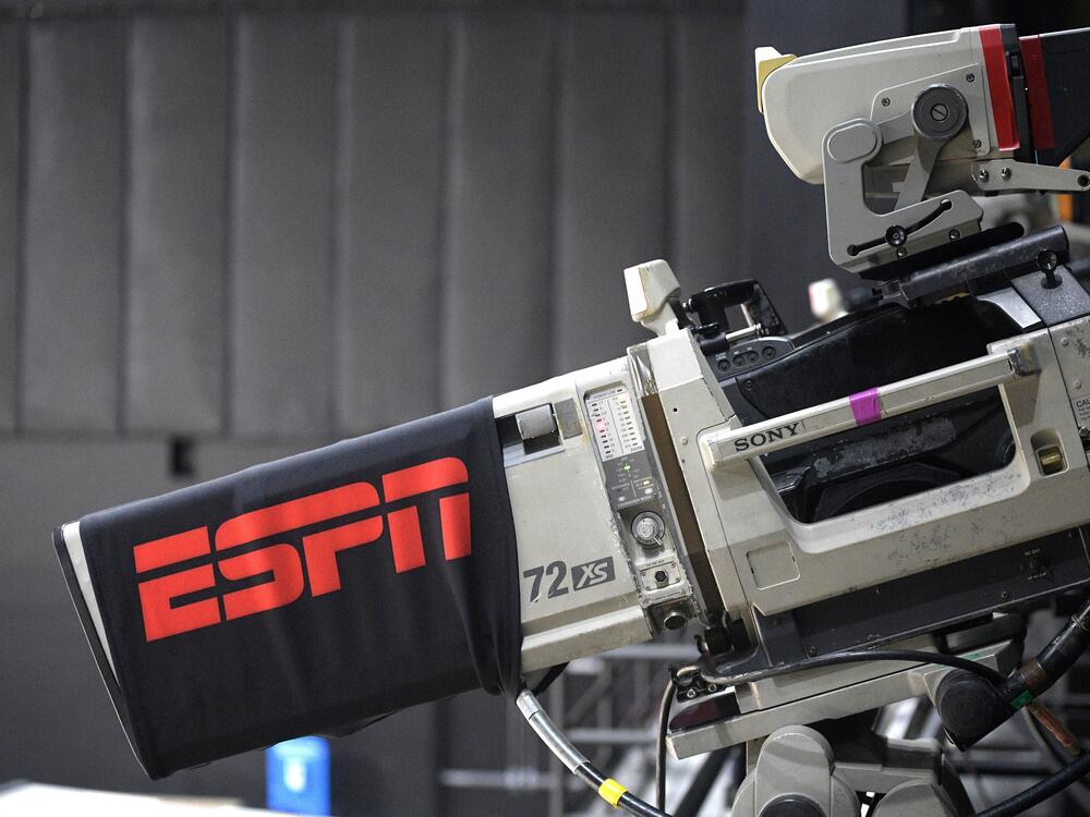 A television camera is viewed during an ESPN broadcast of a WNBA basketball game between the Connecticut Sun and the Minnesota Lynx on July 26, 2020, in Bradenton, Fla. ESPN is launching a new streaming service at $29.99 per month.