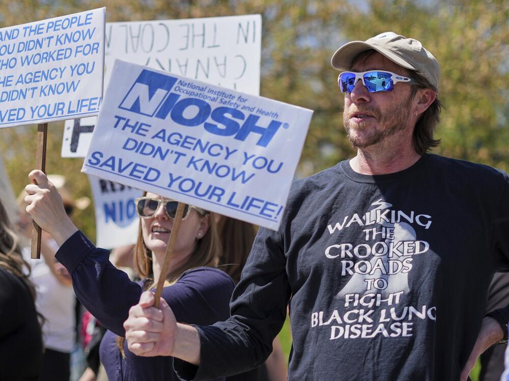 Supporters march outside a National Institute for Occupational Safety and Health facility in Morgantown, W.Va.