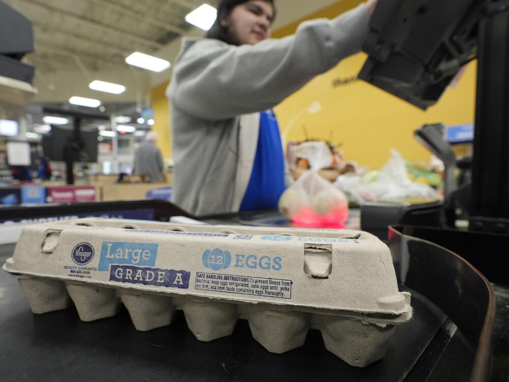 Cashier Josh Jimenez rings up egg for sale at a grocery store in Dallas.