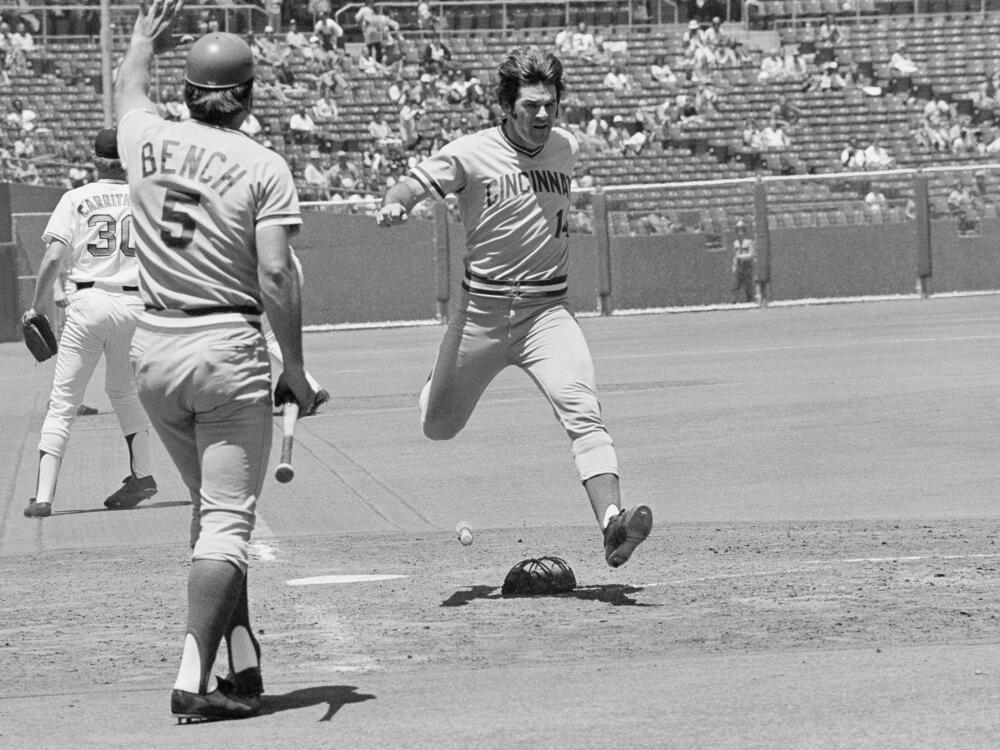 Pete Rose, right, who rapped out his 2,000th career hit during this series in San Francisco, flies across the plate on June 20, 1973. Known as 