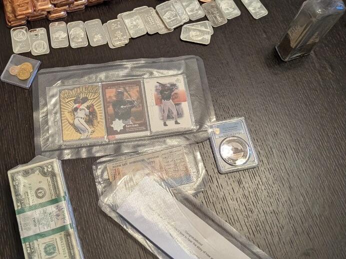 Among the artifacts found in the buried metal box were copper ingots and coins, $2 bills, silver ounces, a gold nugget, three Barry Bonds baseball cards, a bottle of sand, a 1915 commemorative coin, and a ticket to 1939's Golden Gate International Exposition.
