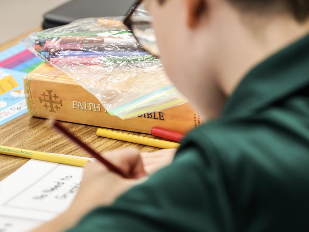 A private school student works on a lesson at St. Luke's Lutheran School in Oviedo, Fla.