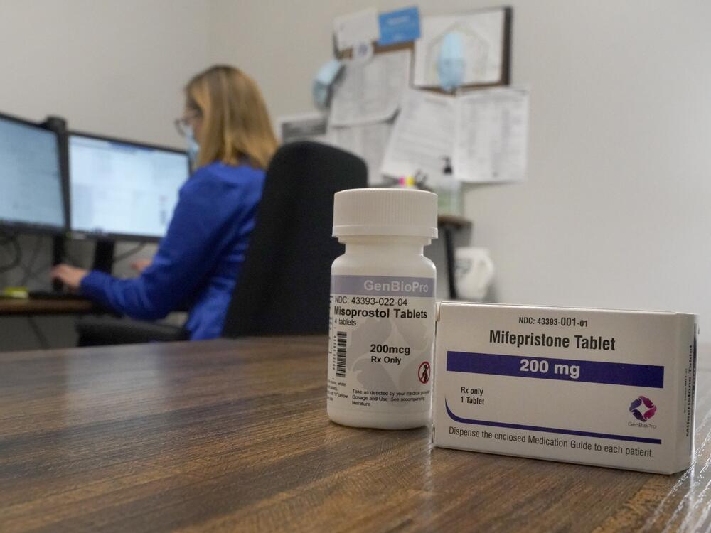 A nurse practitioner works at a Planned Parenthood clinic in Fairview Heights, Ill., where she confers via teleconference with patients seeking medication abortions on Oct. 29, 2021. The two medications used in the process are mifepristone and misoprostol.