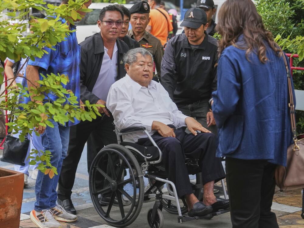 Premchai Karnasuta, the president of Italian-Thai Development Co arrives on a wheelchair at Bang Sue Police Station in Bangkok, Thailand on Friday to surrender to police on criminal negligence charges for the collapse of a Bangkok high-rise during a March 28 earthquake.