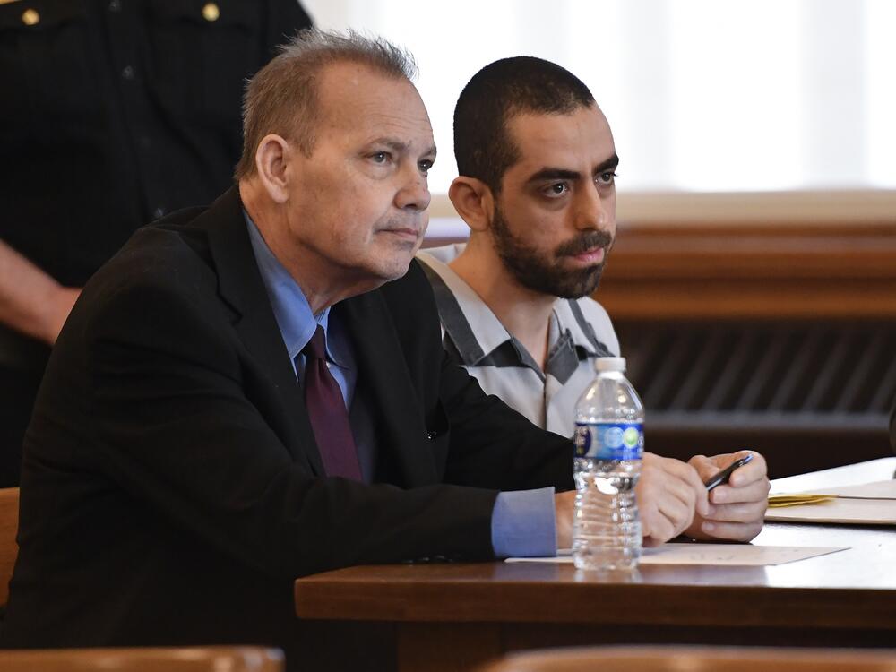 Hadi Matar (right) and public defender Nathaniel Barone listen to Chautauqua County Judge David Foley's sentence in Chautauqua County court in Mayville, N.Y., on Friday.