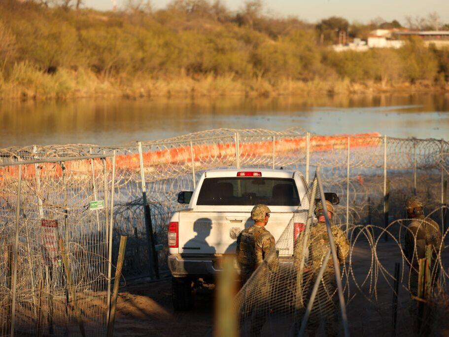 U.S. Army soldiers patrol the U.S.-Mexico border at Eagle Pass, Texas, on Jan. 24. The Trump administration has often used the word invasion to describe illegal immigration, but that framing has not been fully tested in court until now.