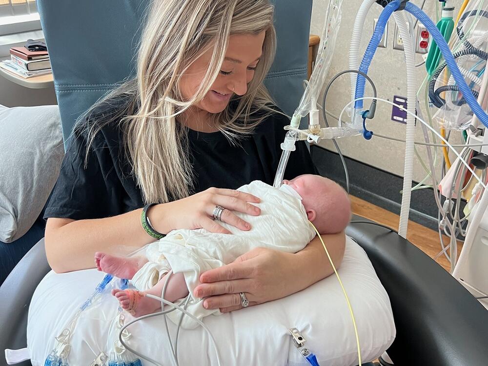 Nicole Muldoon holds her son KJ at Children's Hospital of Philadelphia in August, before a gene-editing treatment was available.