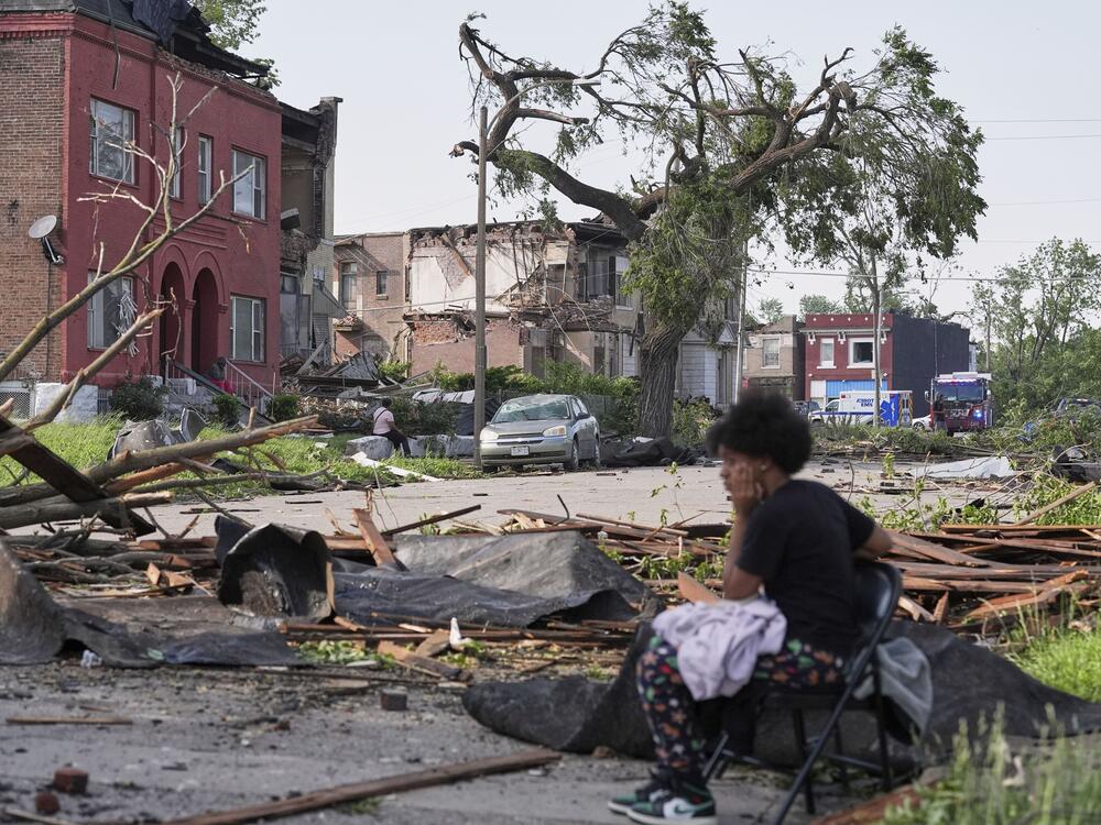 People survey damage after a severe storm moved through Friday, May 16, 2025, in St. Louis.