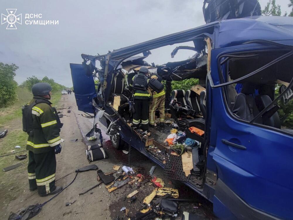 In this photo provided by the Ukrainian Emergency Service, rescuers recover the bodies of passengers after a Russian drone struck a passenger bus at the village of Bilopillya in the Sumy region, Ukraine, on Saturday.