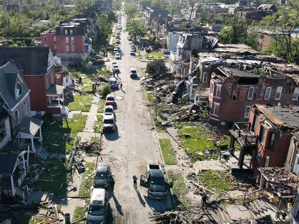 Houses in a neighborhood lie damaged after a tornado struck in St. Louis on