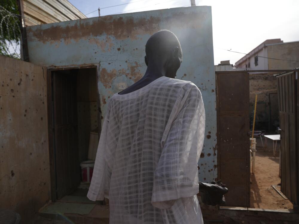 Ahmed Uduma says that bullets and shrapnel pierced his modestly sized brick bungalow — but he and the house survived.