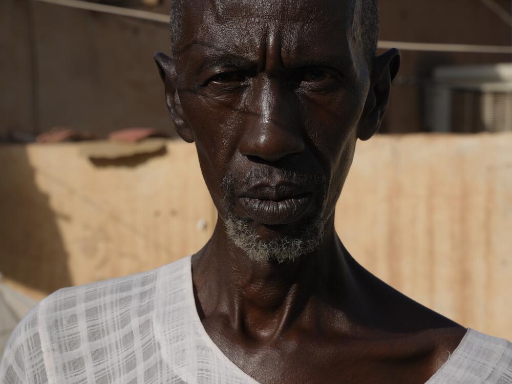 Ahmed Uduma, 63, at his home in Khartoum. His family escaped to Port Sudan at the start of the war but he refused to leave.<br>