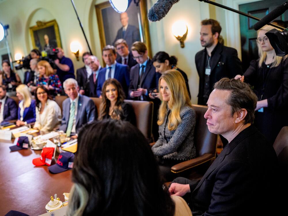 Tesla and SpaceX CEO Elon Musk (right) attends a Cabinet meeting at the White House on April 30, 2025. Musk is stepping back from his guiding role with the Department of Government Efficiency even as the ad hoc team's work continues.