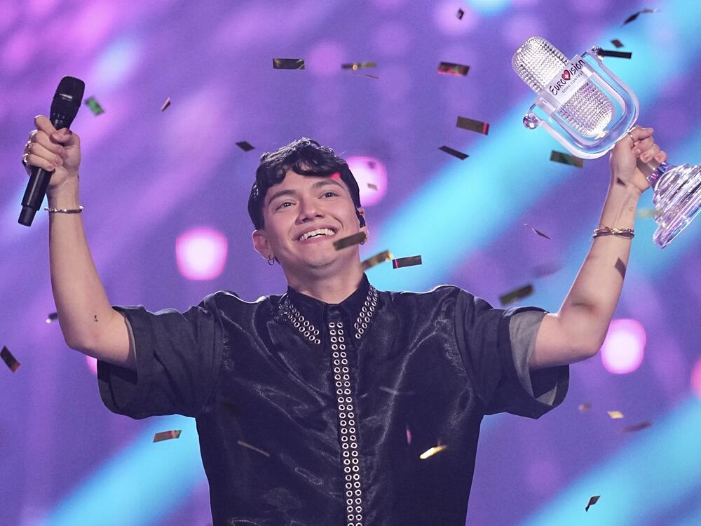 JJ, winner of the 2025 Eurovision Song Contest, holds up the trophy he won for Austria with the song 